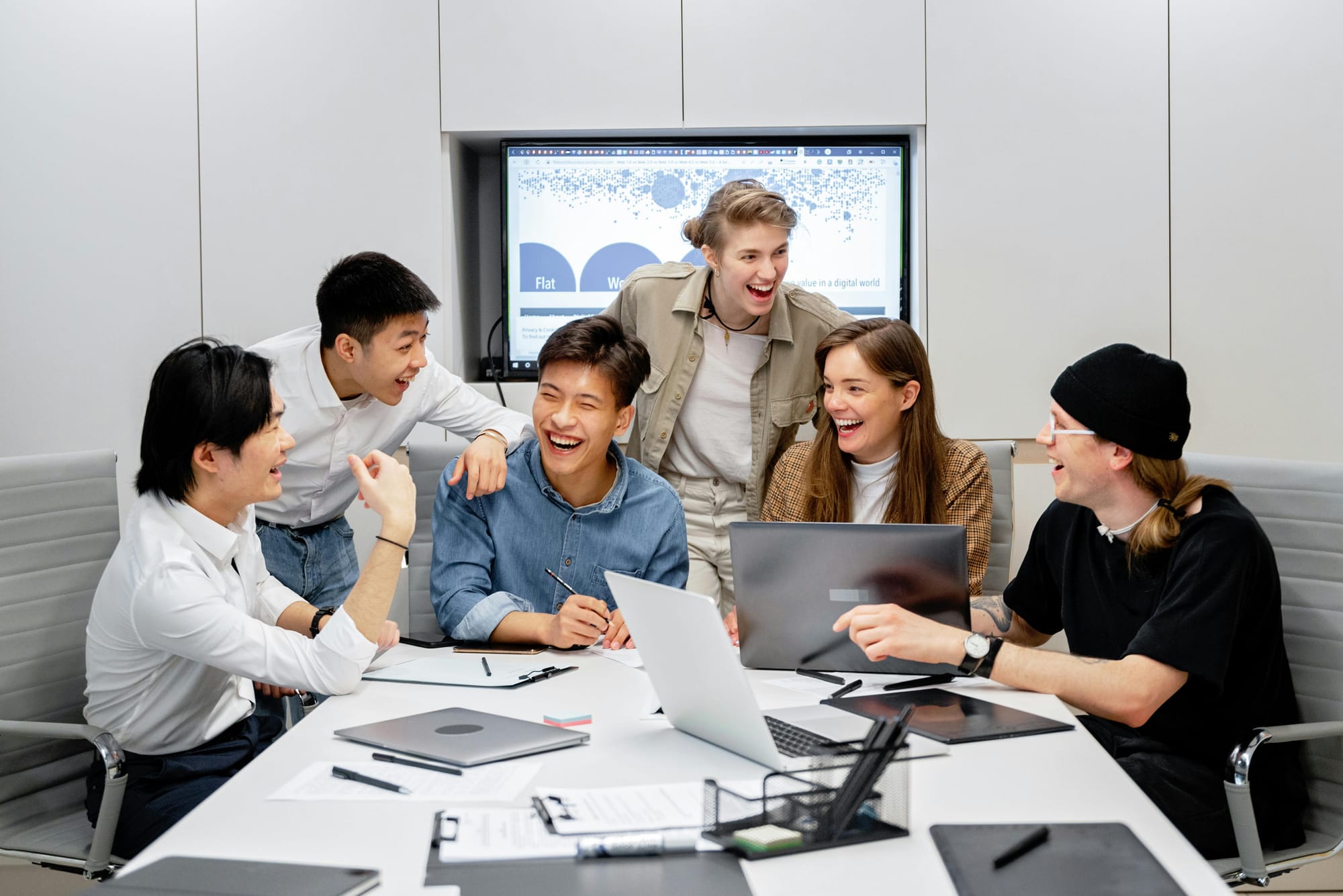 Happy team working in the office together.