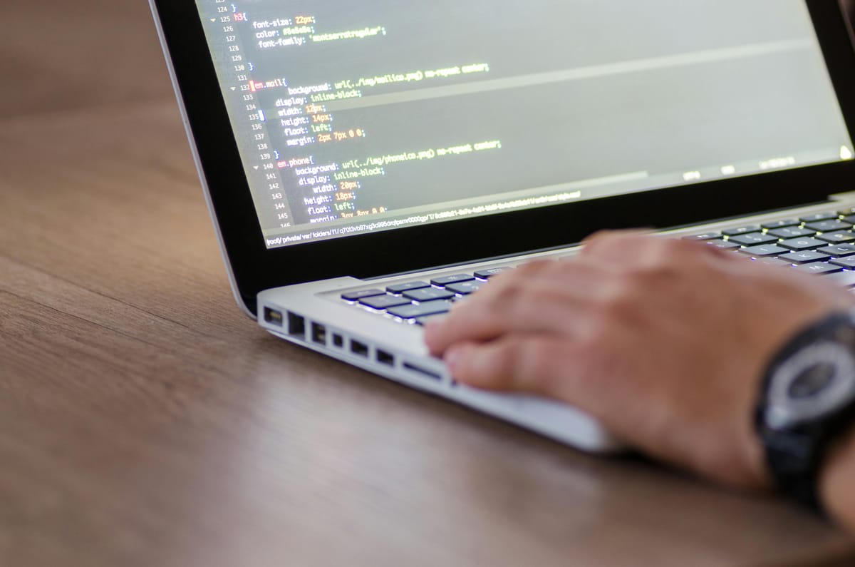 A developer is writing code for the software.