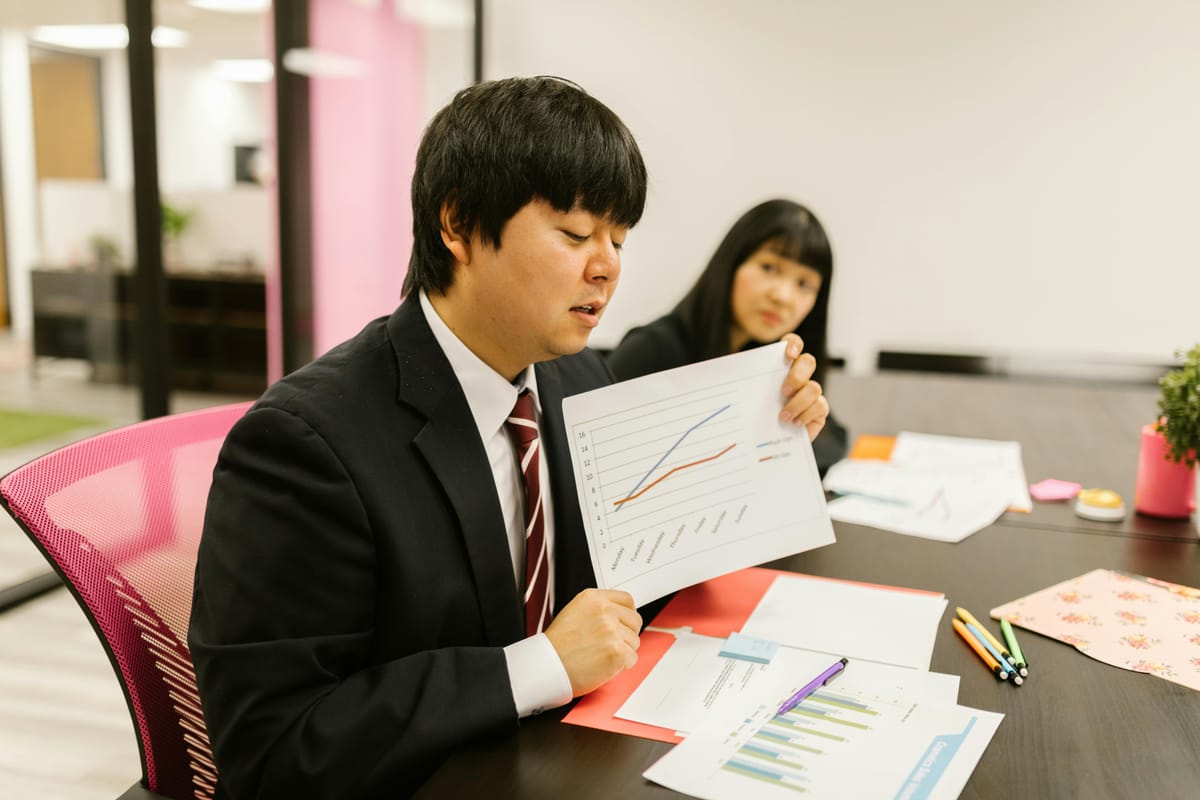 Professionals reviewing report.