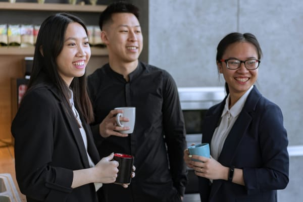 Happy employees smiling together in the office.